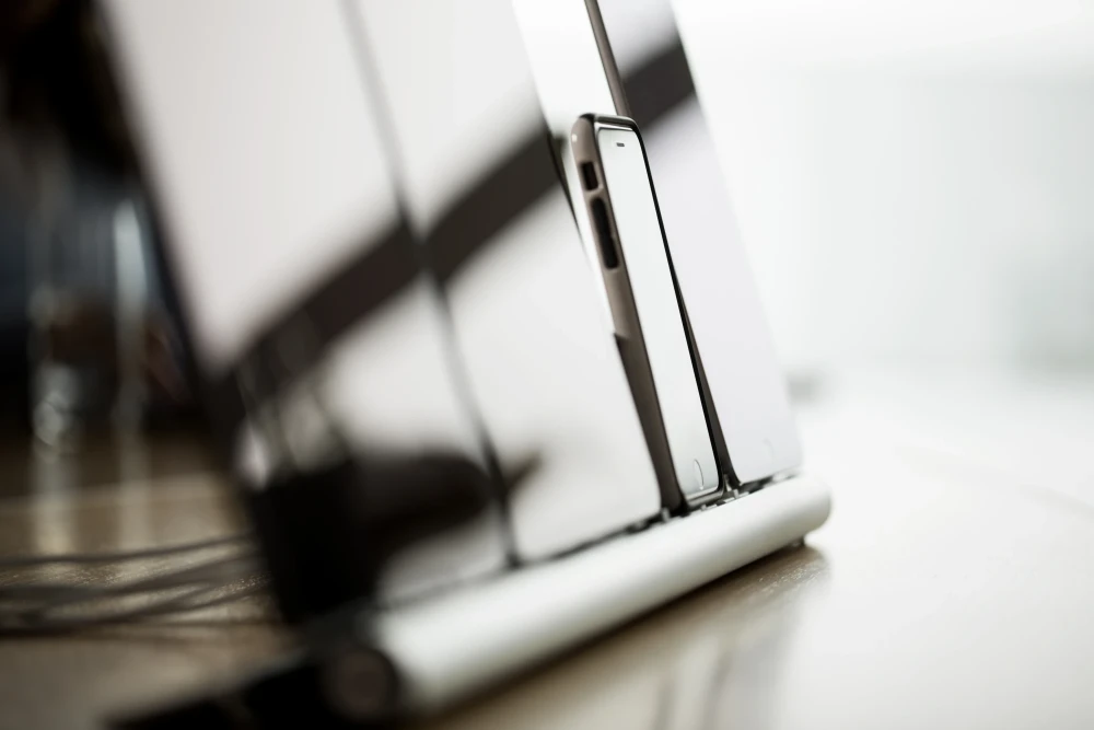 a few mobile devices, photographed from the side and reflecting the light | SPIRIT/21